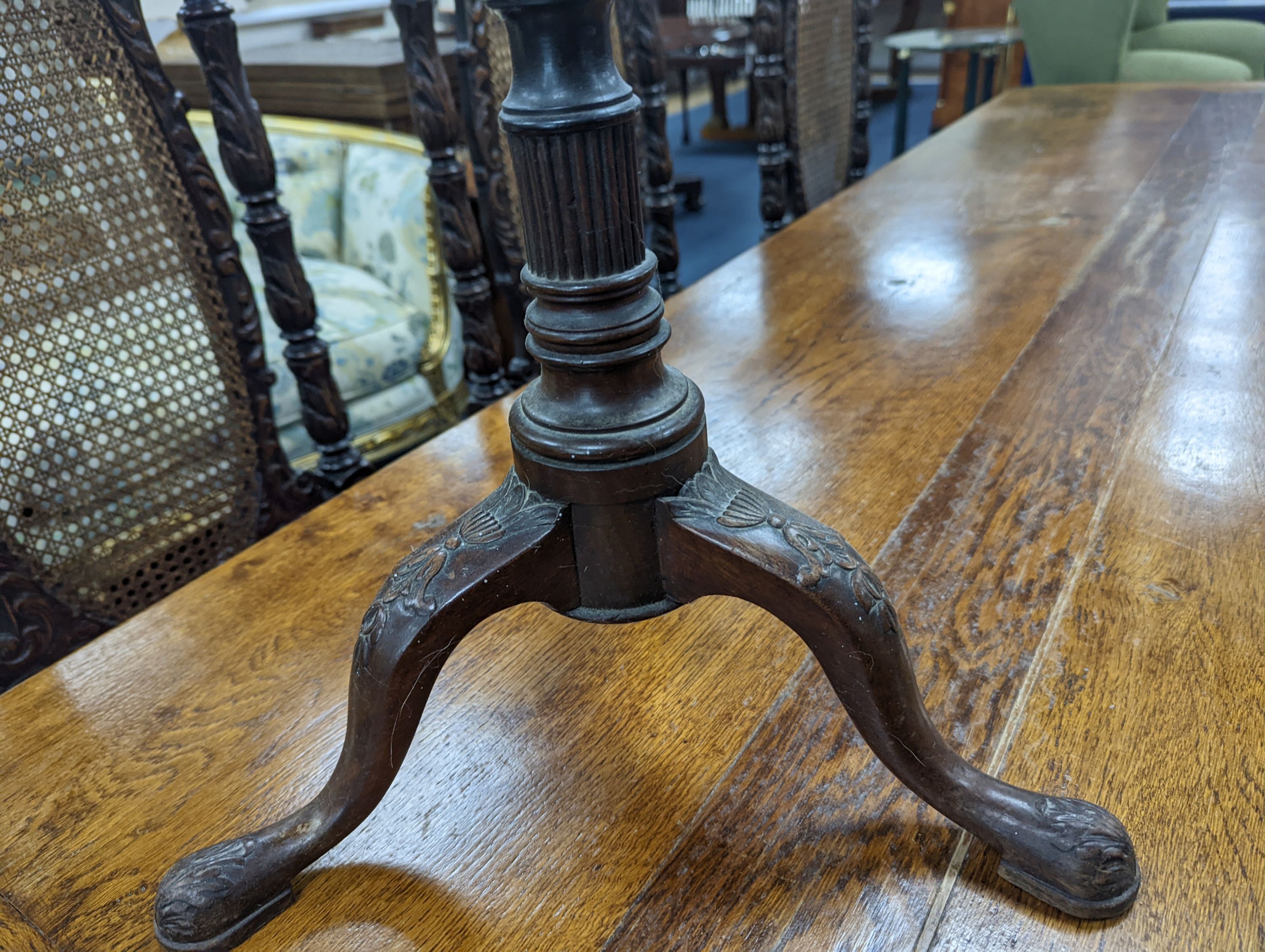 A George III style galleried mahogany tripod wine table incorporating old timber, width 34cm, height 76cm